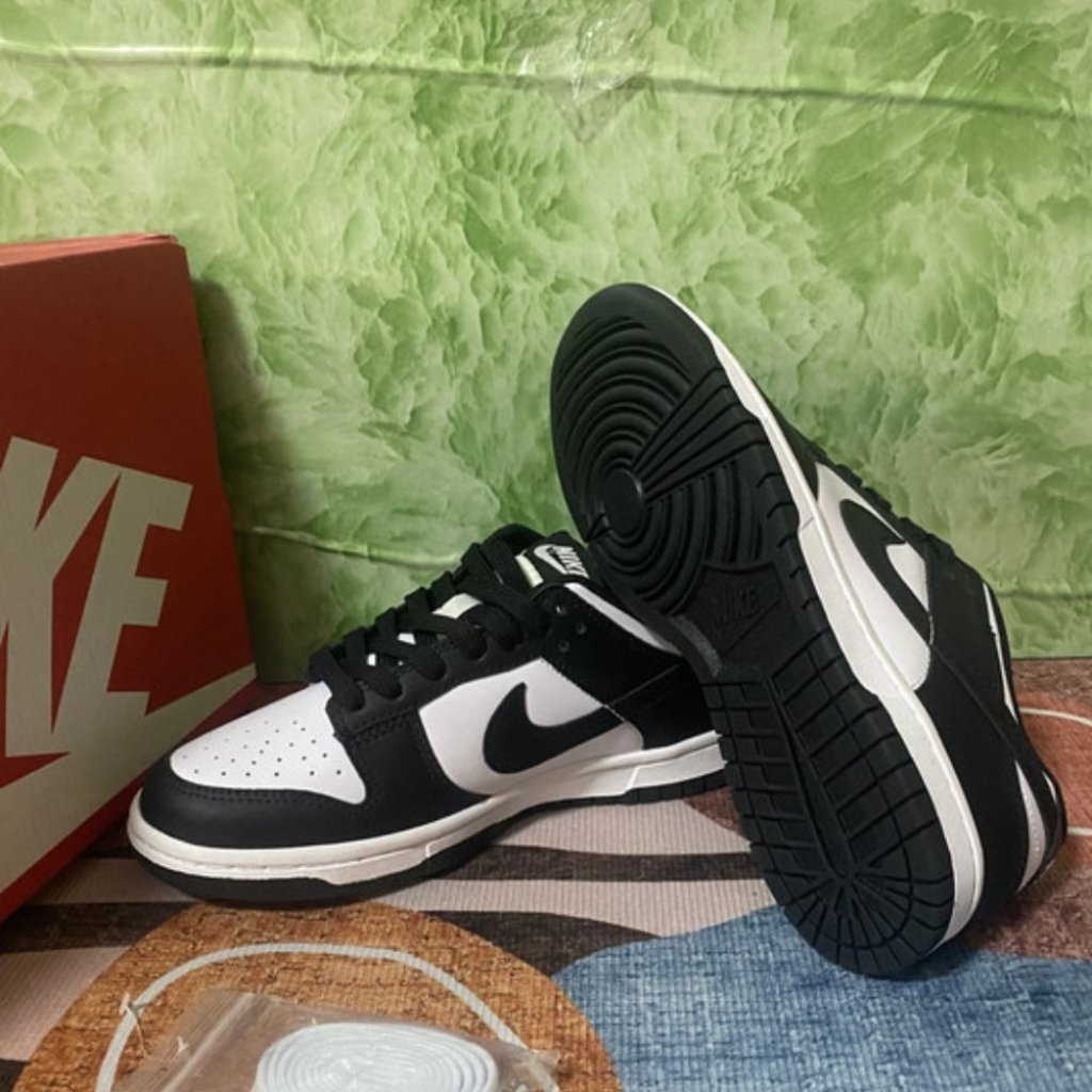 Sleek Black And White Nike Dunk Low Trainers